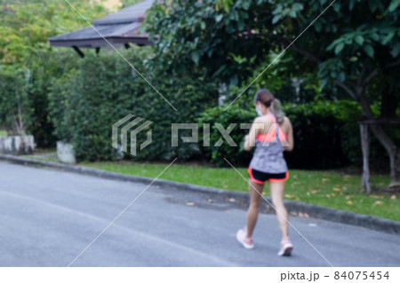 Blurred concept of woman walking in the park health care concept. Blurred concept of woman walking in the park health care concept. 84075454