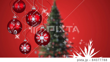 Image of snow falling and baubles over christmas tree on red background Image of snow falling and baubles over christmas tree on red background 84077788