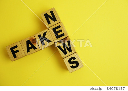 Fake News word alphabet letters on wooden background; Fake News word alphabet letters on wooden background; 84078157