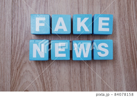 Fake News word alphabet letters on wooden background; Fake News word alphabet letters on wooden background; 84078158