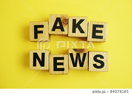 Fake News word alphabet letters on yellow background; 84078165