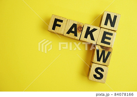 Fake News word alphabet letters on yellow background; Fake News word alphabet letters on yellow background; 84078166