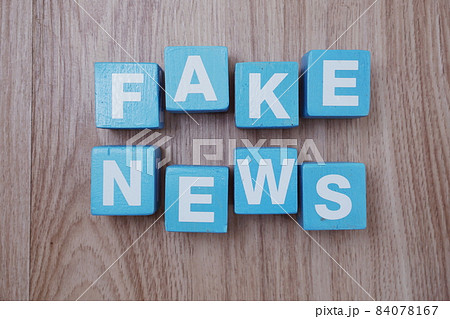 Fake News word alphabet letters on wooden background; Fake News word alphabet letters on wooden background; 84078167