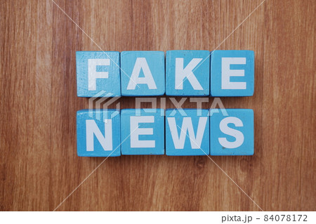 Fake News word alphabet letters on wooden background; Fake News word alphabet letters on wooden background; 84078172