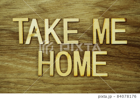 Take Me Home text message on wooden background 84078176