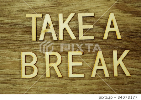 Take a Break text message on wooden background 84078177