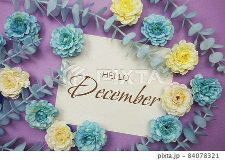 Hello December typography text and flower decorate on purple background 84078321
