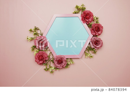 Blue Hexagon background and pink border decorate with flowers on pink background 84078394