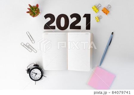 Year 2022 numbers and stationery on white table Year 2022 numbers and stationery on white table 84079741