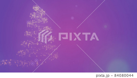 Image of snow falling over glowing christmas tree Image of snow falling over glowing christmas tree 84080044