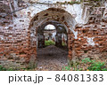 The ruins of an ancient red brick church with remnants of white plaster. 84081383