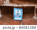 The image of the holy martyr, inserted into a niche in the brick wall. 84081388