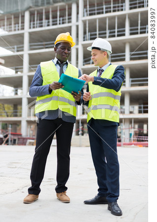 Two architects discussing construction project 84083997