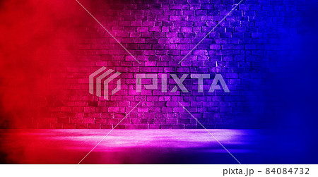 Studio dark room with fog or mist and lighting effect red and blue on brick wall and concrete floor grunge texture background. 84084732