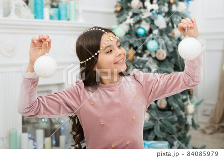 Child smiling girl hold christmas ornament. Adorable Child smiling girl hold christmas ornament. Adorable 84085979