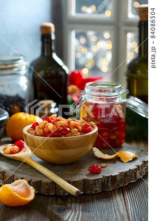 Mixed dried fruits and raisins soaked in spices in rum. 84086504