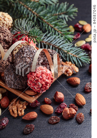 Chocolates and a fir branch. 84087046