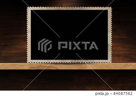 Empty Old Fashioned Photo Frame on a Wooden Shelf 84087562