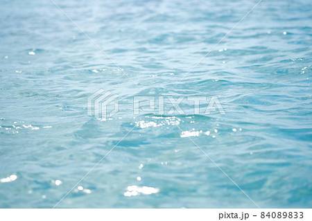 Close-up of blue water in the sea or ocean. Side view. Copy space.Empty showcase,packaging product presentation.Background for cosmetic products. Close-up of blue water in the sea or ocean. Side view. Copy space.Empty showcase,packaging product presentation.Background for cosmetic products. 84089833