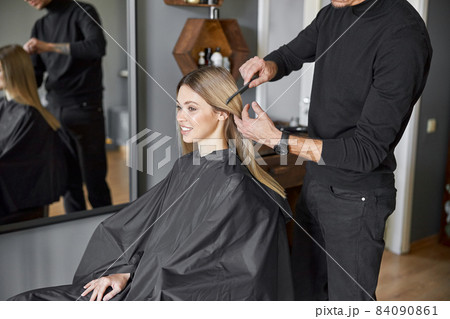 Hair drying process in modern hairdresser's salon 84090861