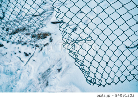 Hole in wire border fence. 84091202