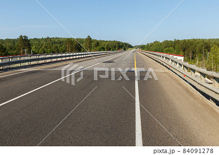 Asphalt road in Siberia. 84091278