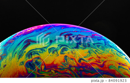 Virtual reality space with abstract multicolor psychedelic planet. Closeup Soap bubble like an alien planet on black background. Virtual reality space with abstract multicolor psychedelic planet. Closeup Soap bubble like an alien planet on black background. 84091923