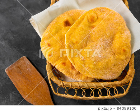 Homemade corn flatbread breadbasket gluten free meal. Handmade mexican tortilla wrapping. Traditional latin cornmeal 84099100