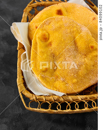 Homemade corn flatbread breadbasket gluten free meal. Handmade mexican tortilla wrapping. Traditional latin cornmeal 84099102