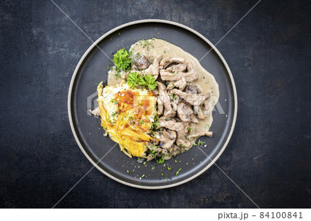 Traditional Swiss zurcher geschnetzeltes with rosti 84100841