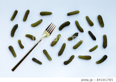 Pickled gherkins or cucumbers on white background. Pickled gherkins or cucumbers on white background. 84101765