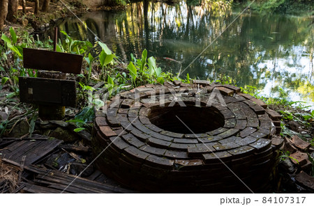 The holy well in the Buddha garden on Doi Chang in Chiang Rai province of Thailand. In the history the water of this well is using for Thai king sacred ceremony (accession to the throne). 84107317