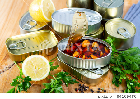 Pickled mussels in oil with parsley, lemon, spices 84109480