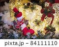 snowman toy in Santa Claus costume with decorated gift box 84111110