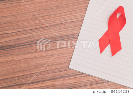 Red ribbon symbolizes world health day 84114233