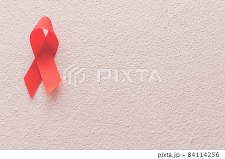 Red ribbon symbolizes world health day 84114256