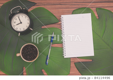 Notebook and coffee mug On the desk Notebook and coffee mug On the desk 84114496