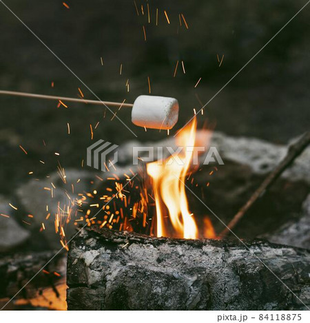 person burning marshmallows camp fire 2. High quality beautiful photo concept 84118875