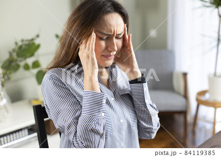 Young tired working woman at home office Young tired working woman at home office 84119385