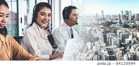 Business team wearing headset working actively in office Business team wearing headset working actively in office 84120994