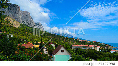Resort town on coast with houses for rent among exotic plants between the mountains and the sea Resort town on coast with houses for rent among exotic plants between the mountains and the sea 84122998