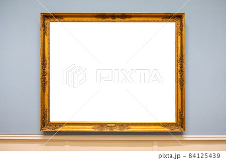 Golden carved picture frame on wall Golden carved picture frame on wall 84125439