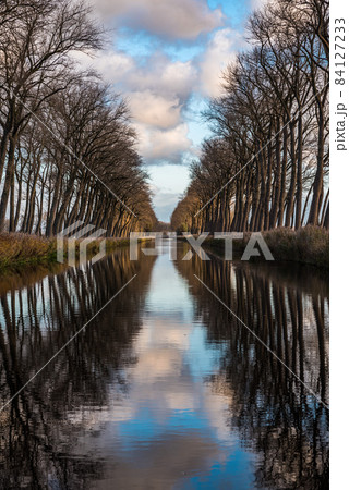 Colorful reflections at the canal near Bruges 84127233