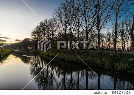 Colorful reflections at the canal near Bruges 84127238