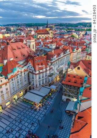 Top aerial panoramic view of Prague Old Town Stare Mesto historical city centre with red tiled roof buildings 84128403