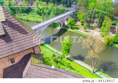 Bridge over Eger river top aerial view from walls of Loket Castle Hrad Loket gothic style building 84128417