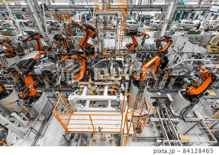 Photo of automobile production line. Welding car body. Modern car assembly plant. Top view 84128465