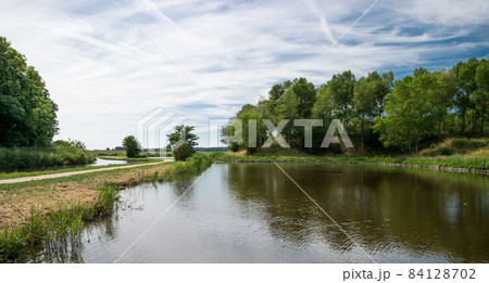 Landscape view over a natural water pond Landscape view over a natural water pond 84128702