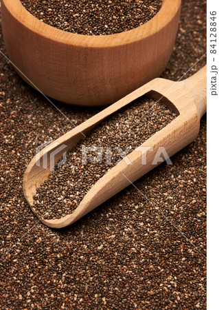 Organic natural chia seeds, wooden scoop and bowl close-up 84128846