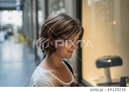 Attractive white woman posing in an historic shopping mall Attractive white woman posing in an historic shopping mall 84129236